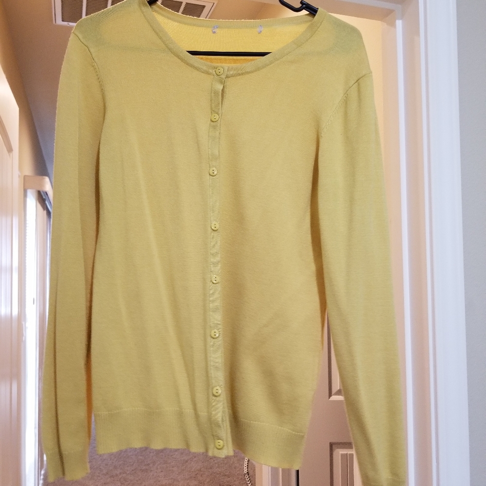 Women's Gold Cardigan sweater.